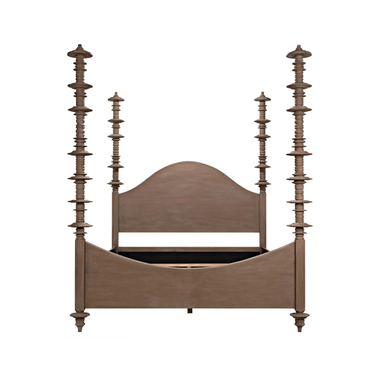 A brown, wooden bed frame with intricate, tall posts and a curved headboard.